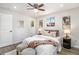 Cozy bedroom with a ceiling fan, comfortable furnishings, and artwork enhancing the serene atmosphere at 6775 Newland St, Arvada, CO 80003