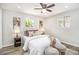Inviting bedroom with neutral tones, comfortable bedding, and ample natural light from the windows at 6775 Newland St, Arvada, CO 80003