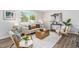 Bright living room featuring modern furniture, a large window, and stylish decor at 6775 Newland St, Arvada, CO 80003