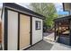 Exterior view of a shed with modern door, window and access to basement at 6775 Newland St, Arvada, CO 80003