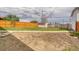 A spacious backyard with green grass, wooden fencing, and a garden area, ready for outdoor enjoyment at 9100 Yucca Way, Thornton, CO 80229