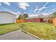 Expansive backyard featuring a well-kept lawn, mature trees, and a covered patio for outdoor enjoyment at 9100 Yucca Way, Thornton, CO 80229