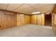 The basement has neutral carpeting and access to an unfinished area at 9100 Yucca Way, Thornton, CO 80229