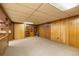 The basement features wood paneling, closet, and built in shelves at 9100 Yucca Way, Thornton, CO 80229