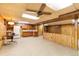 Open basement area featuring kitchenette with cabinets and appliances at 9100 Yucca Way, Thornton, CO 80229