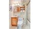 Cozy bathroom with tiled walls, natural wood vanity, and shower at 9100 Yucca Way, Thornton, CO 80229