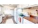 Clean kitchen boasts modern appliances, ample counter space, and eat-in breakfast nook at 9100 Yucca Way, Thornton, CO 80229