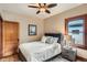 Cozy bedroom with hardwood floors, soft lighting, and comfortable furnishings for a relaxing retreat at 827 S Sherman St, Denver, CO 80209