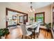 Inviting dining area featuring hardwood floors, modern lighting, and an open flow to the living room at 827 S Sherman St, Denver, CO 80209