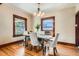 Bright dining room featuring hardwood floors, modern lighting, and ample natural light from large windows at 827 S Sherman St, Denver, CO 80209