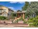Quaint home with brick facade, garden beds, and manicured landscaping in a residential neighborhood at 827 S Sherman St, Denver, CO 80209