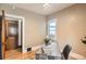 Office space featuring a rustic wooden desk, bright natural light and a decorative accent rug at 827 S Sherman St, Denver, CO 80209