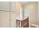 Stairwell with upper floor access and storage cabinets at 827 S Sherman St, Denver, CO 80209