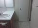 Standard bathroom featuring a vanity sink and tile countertop, offering a functional and clean design at 12172 Huron St # 207, Denver, CO 80234