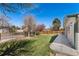 Expansive backyard with a well-maintained lawn and wooden privacy fence at 7391 S Marion St, Centennial, CO 80122