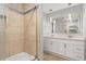 Modern bathroom with a combination shower and tub and double sinks at 7391 S Marion St, Centennial, CO 80122