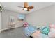 Charming bedroom featuring a ceiling fan, window, and closet at 7391 S Marion St, Centennial, CO 80122