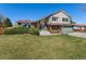 Attractive front yard with mature landscaping and a well-maintained lawn at 7391 S Marion St, Centennial, CO 80122