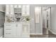 Contemporary kitchen bar with custom cabinetry, modern backsplash, and stylish lighting at 7391 S Marion St, Centennial, CO 80122