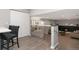Stylish living room featuring a cozy fireplace and access to a modern kitchen/bar area at 7391 S Marion St, Centennial, CO 80122