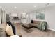 Open-concept living room featuring hardwood floors, recessed lighting, and easy access to a modern kitchen at 7391 S Marion St, Centennial, CO 80122
