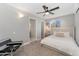 Comfortable bedroom with neutral carpet, ceiling fan, and ample natural light from the window at 7391 S Marion St, Centennial, CO 80122