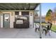 Outdoor kitchen with built-in grill and dining area, perfect for entertaining at 7391 S Marion St, Centennial, CO 80122