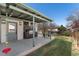 Covered patio with outdoor kitchen and dining area at 7391 S Marion St, Centennial, CO 80122