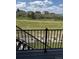 A view from the back deck, showing a grassy backyard and trees at 901 Coal Bank Trl, Castle Rock, CO 80104
