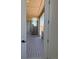 Covered balcony with wooden flooring, a sliding door, and a view of the neighborhood at 901 Coal Bank Trl, Castle Rock, CO 80104