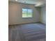 Bright bedroom featuring neutral carpet and a view to the outdoors at 901 Coal Bank Trl, Castle Rock, CO 80104