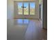 Open dining area featuring sleek wood flooring and large windows offering abundant natural light at 901 Coal Bank Trl, Castle Rock, CO 80104