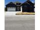 Charming single-Gathering home with a white garage door, concrete driveway and professional landscaping at 901 Coal Bank Trl, Castle Rock, CO 80104