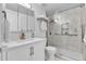 Clean bathroom features a modern vanity, ample storage, and a glass-enclosed shower at 11404 W Sharkstooth Peak, Littleton, CO 80127