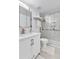 Clean bathroom features a modern vanity, ample storage, and a glass-enclosed shower at 11404 W Sharkstooth Peak, Littleton, CO 80127