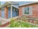 Inviting front porch with well-manicured landscaping and flower accents at 11404 W Sharkstooth Peak, Littleton, CO 80127