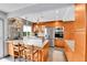 Stylish kitchen with stainless appliances, granite counters and breakfast bar at 11404 W Sharkstooth Peak, Littleton, CO 80127