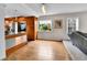 Bright kitchen with hardwood floors, stainless steel appliances, and modern accents at 11404 W Sharkstooth Peak, Littleton, CO 80127
