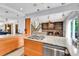 Open concept kitchen with granite counters, stainless appliances, open to living at 11404 W Sharkstooth Peak, Littleton, CO 80127