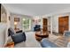 Spacious living room with ample seating, a round table, and natural light at 11404 W Sharkstooth Peak, Littleton, CO 80127