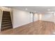 Finished basement with luxury vinyl plank flooring and barn door access at 8271 Bluebell Way, Denver, CO 80221