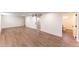 Spacious basement features vinyl plank flooring and bathroom access at 8271 Bluebell Way, Denver, CO 80221