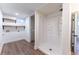A well lit bathroom area with a shower and washer/dryer hookups at 8271 Bluebell Way, Denver, CO 80221