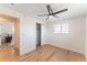 Bedroom features hardwood floors, and closet, with ceiling fan with light at 8271 Bluebell Way, Denver, CO 80221
