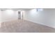 Spacious bedroom with neutral carpet, white trim, and bright natural light at 8271 Bluebell Way, Denver, CO 80221