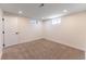 Cozy carpeted bedroom featuring bright natural light and a neutral color scheme at 8271 Bluebell Way, Denver, CO 80221
