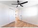 Bedroom features hardwood floors, and closet, with ceiling fan with light at 8271 Bluebell Way, Denver, CO 80221