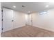 A bright bedroom with carpet, multiple windows, and crisp white trim at 8271 Bluebell Way, Denver, CO 80221