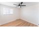 Bright bedroom features hardwood floors, and ceiling fan with light at 8271 Bluebell Way, Denver, CO 80221