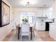 Charming dining area with natural light and access to the kitchen at 8271 Bluebell Way, Denver, CO 80221